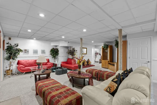 a living room with furniture and a rug