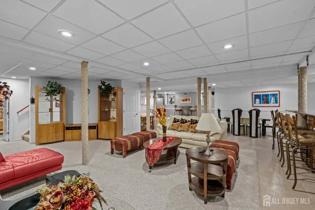 a bedroom with furniture and a wooden floor