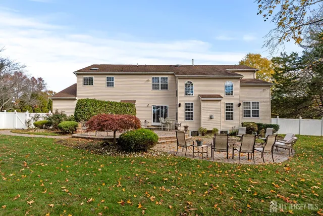 a view of a backyard with sitting area and garden