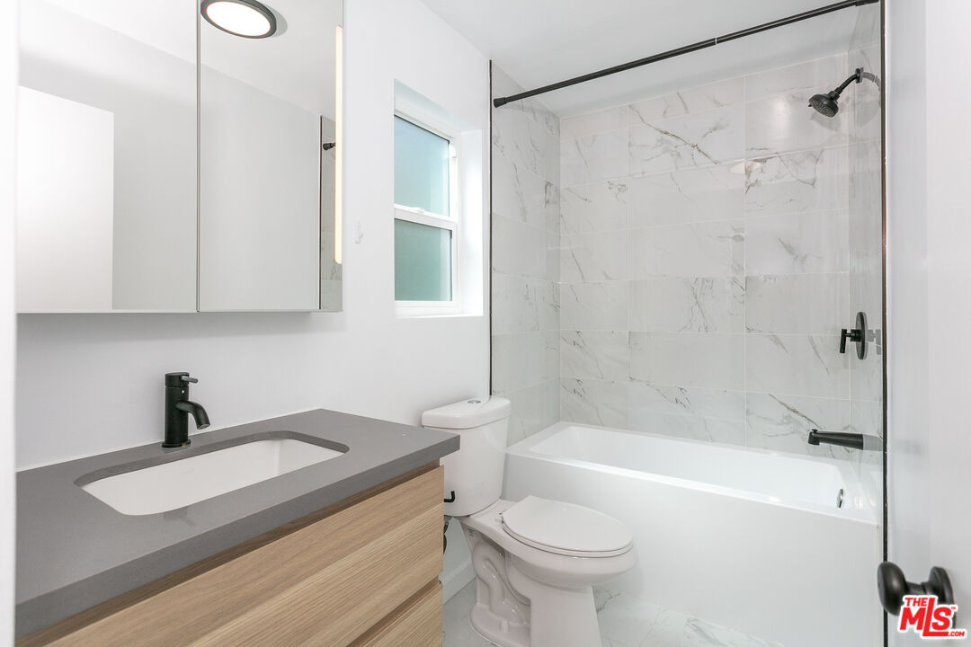 560 North Kings Road, Unit 2 West Hollywood, CA 90048 - Photo 9 of 12 a bathroom with a sink a toilet and a bathtub