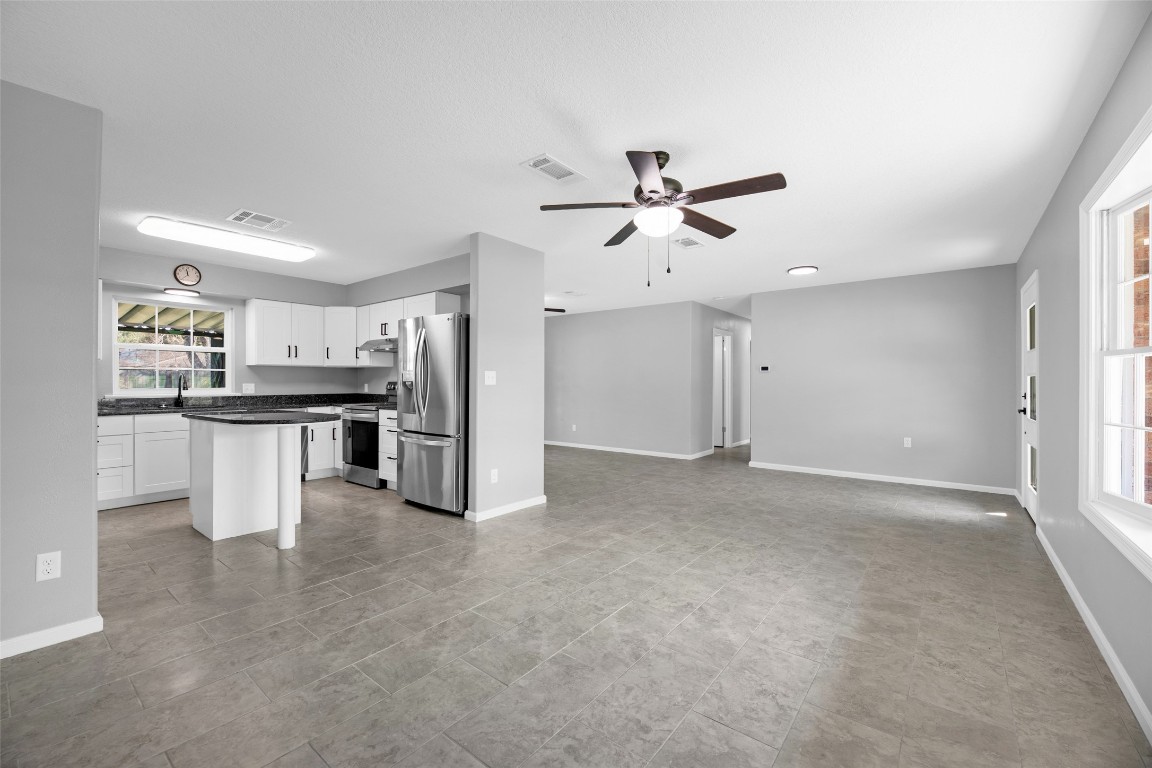 605 Helms Avenue Wharton, TX 77488 - Photo 15 of 45 Kitchen comes with fridge, stove, dishwasher, microwave, farmhouse sink and more!