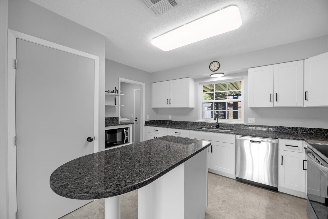 605 Helms Avenue Wharton, TX 77488 - Photo 17 of 45 Yes! There is a pantry, coffee bar with small wine rack and huge pot drawer!