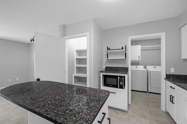 a bathroom with a shower and a sink