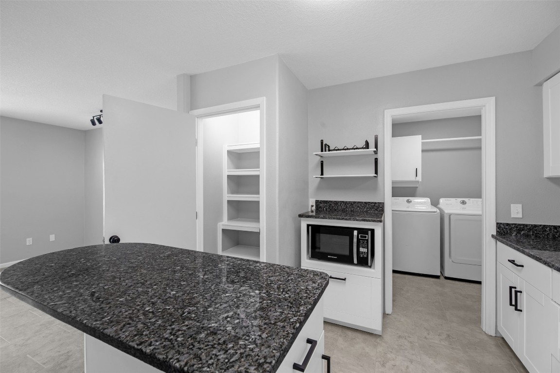 605 Helms Avenue Wharton, TX 77488 - Photo 18 of 45 Lighted pantry with shelf space, brand new breakfast/prepping island