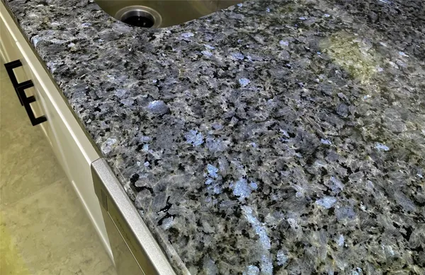 an empty room with closet and a ceiling fan