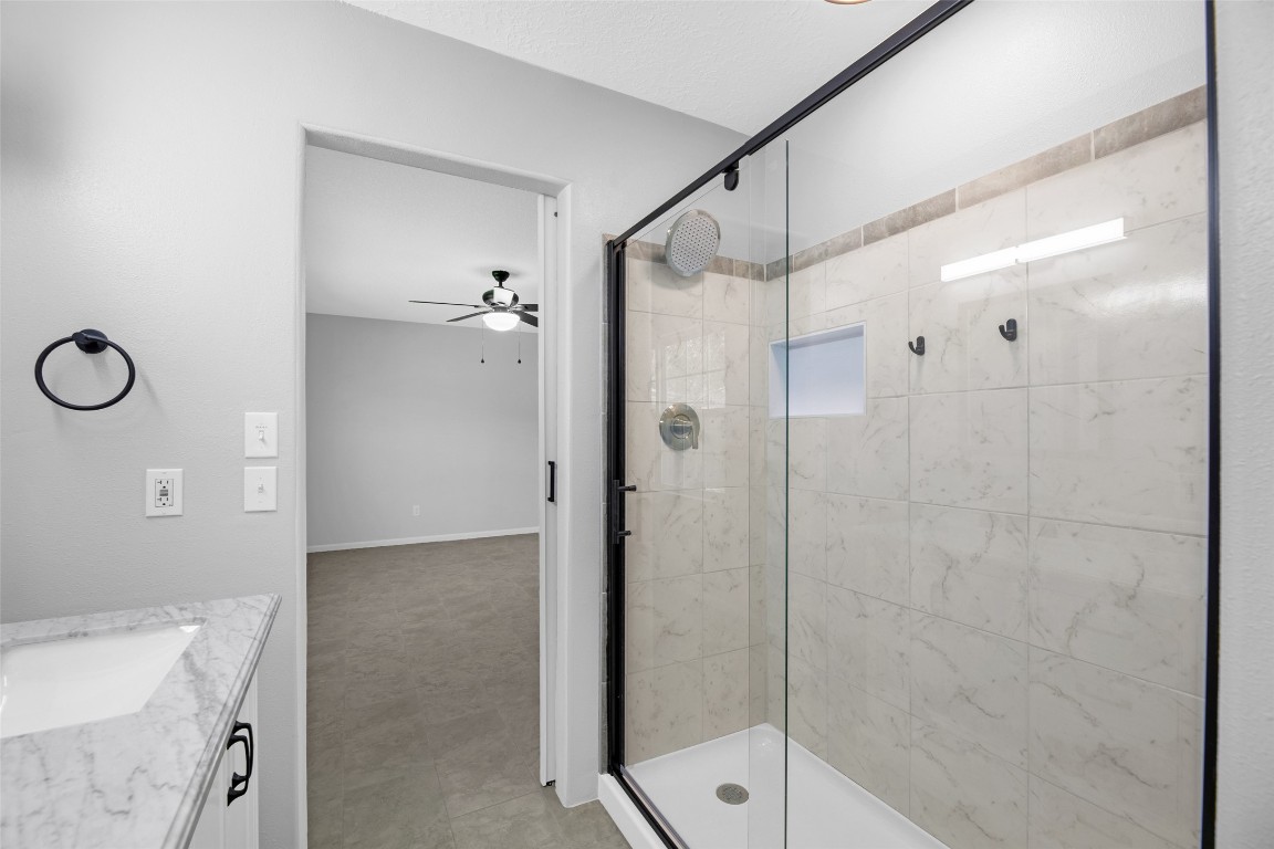 605 Helms Avenue Wharton, TX 77488 - Photo 32 of 45 Master bath walk in shower with glass doors and seating