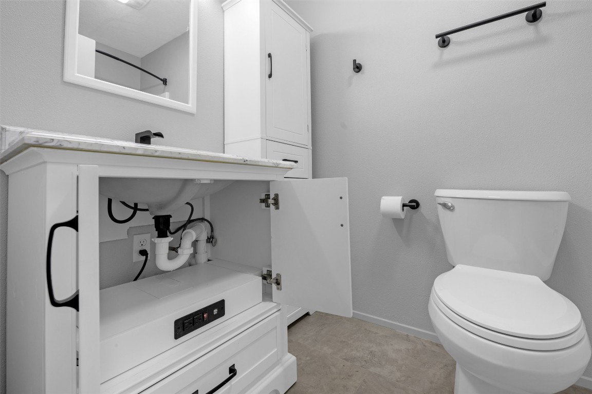 605 Helms Avenue Wharton, TX 77488 - Photo 36 of 45 Both baths have USB for phone charging/electrical outlets under sink.