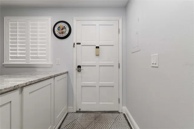 a bathroom with a granite countertop sink a toilet and shower