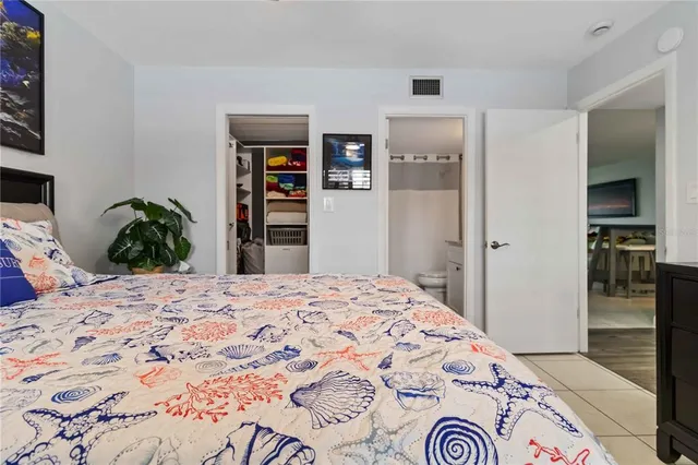 a bedroom with a bed and a closet