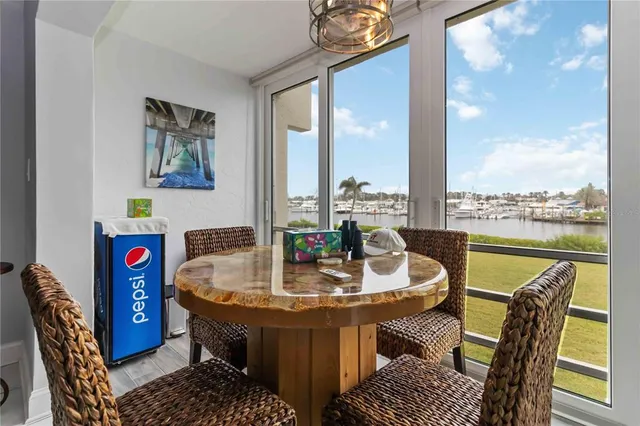 a bathroom with a granite countertop sink mirror vanity and toilet