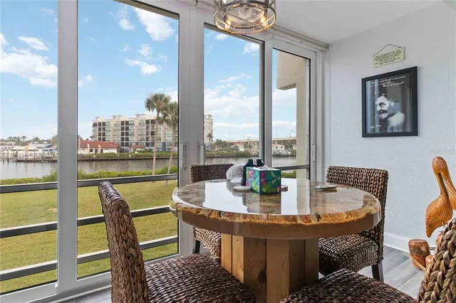 a terrace with outdoor seating city view and lake view