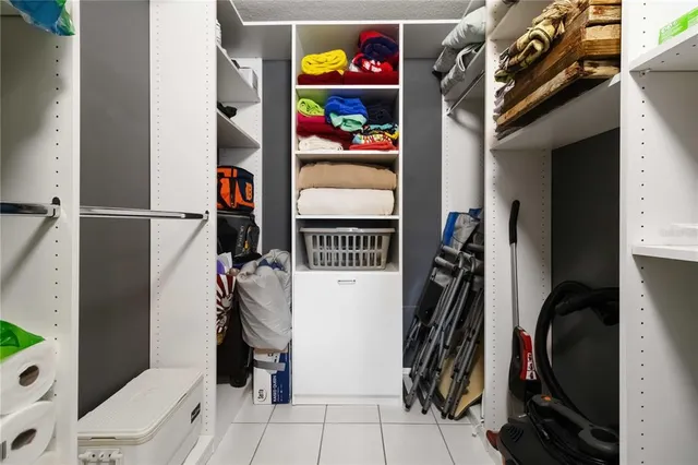 a view of a livingroom with furniture and floor to ceiling window