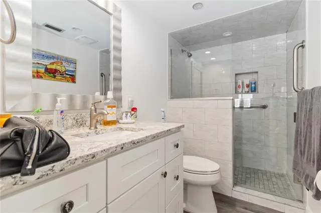 a living room with furniture a rug and a ceiling fan