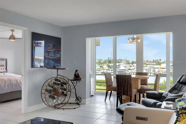 a kitchen with granite countertop a sink a counter top space cabinets and stainless steel appliances