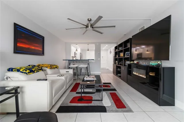 a view of a livingroom with furniture and a flat screen tv
