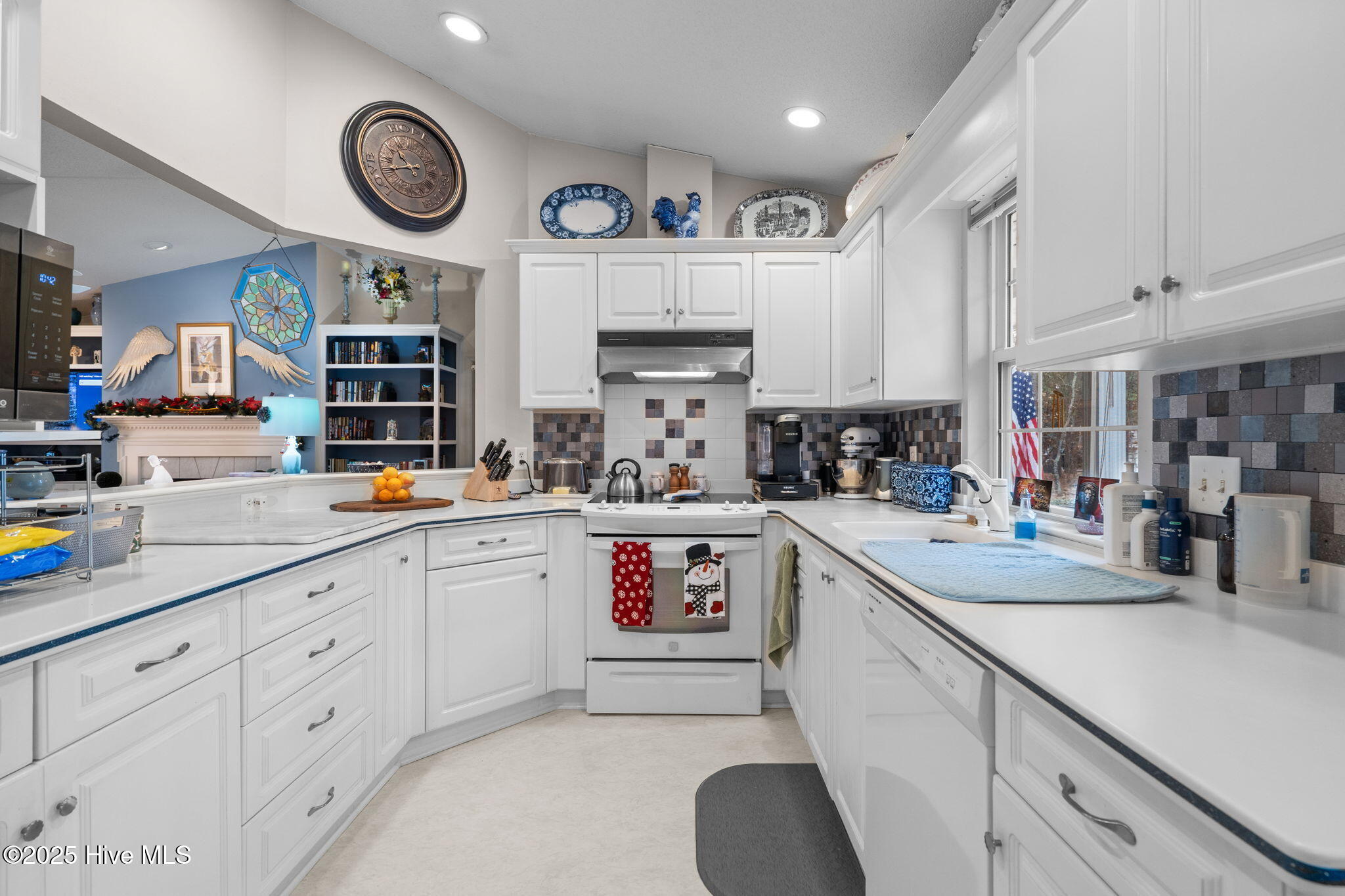 247 Longleaf Drive West End, NC 27376 - Photo 14 of 79 View of the kitchen from eating area. Lots of counter space and work areas. Keeps all the work in progress hidden.
