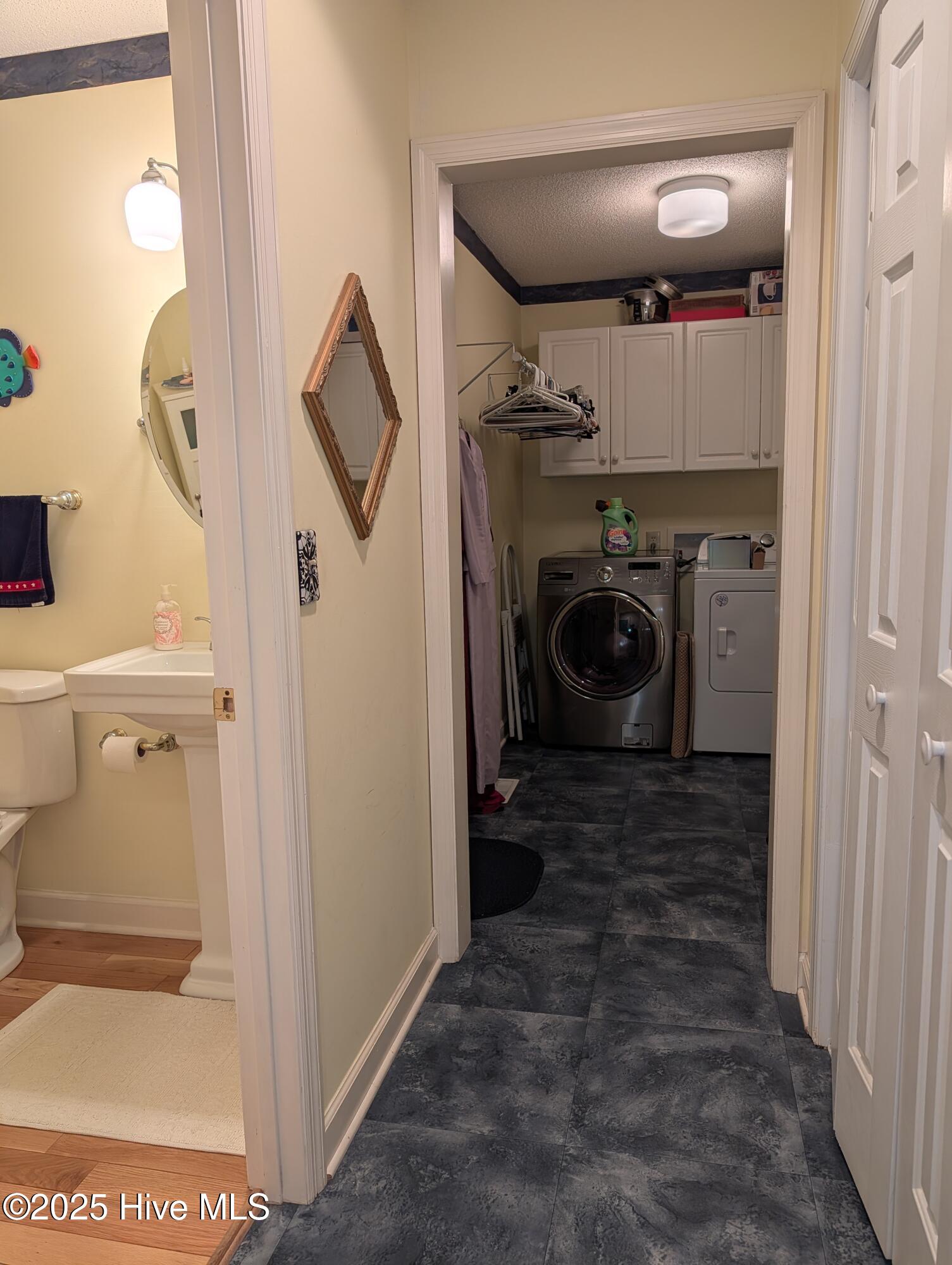 247 Longleaf Drive West End, NC 27376 - Photo 28 of 79 View of Hallway to powder room, laundry room and garage.