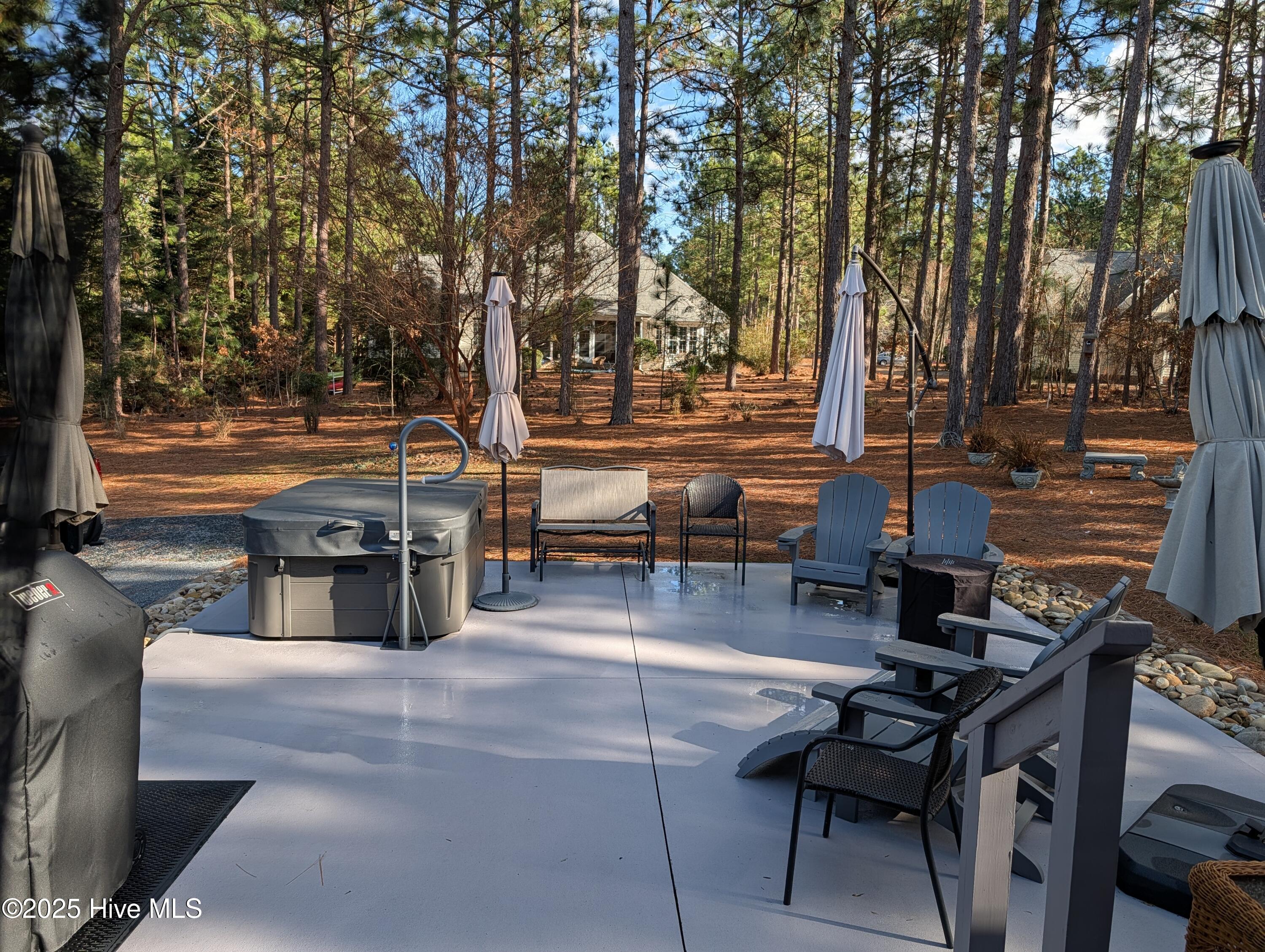 247 Longleaf Drive West End, NC 27376 - Photo 42 of 79 View of deck and patio area from the Carolina room.