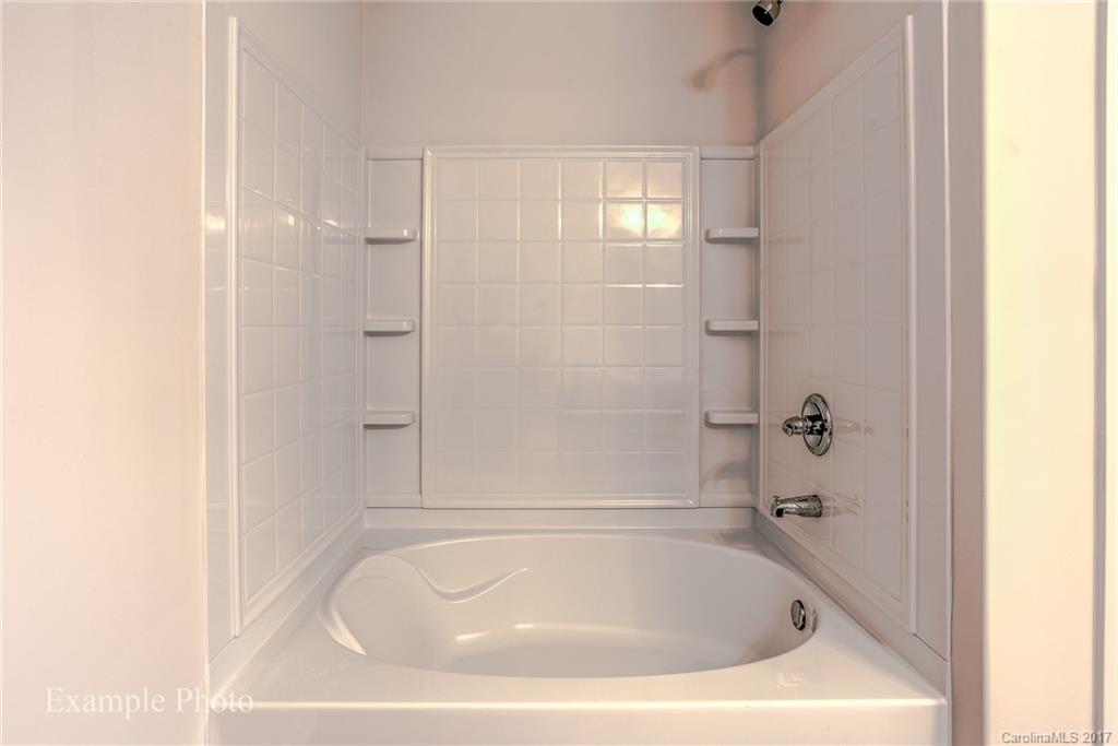 2155 Gunnars Ridge Road, Unit 23 Lancaster, SC 29720 - Photo 22 of 24 a white bath tub sitting in a bathroom