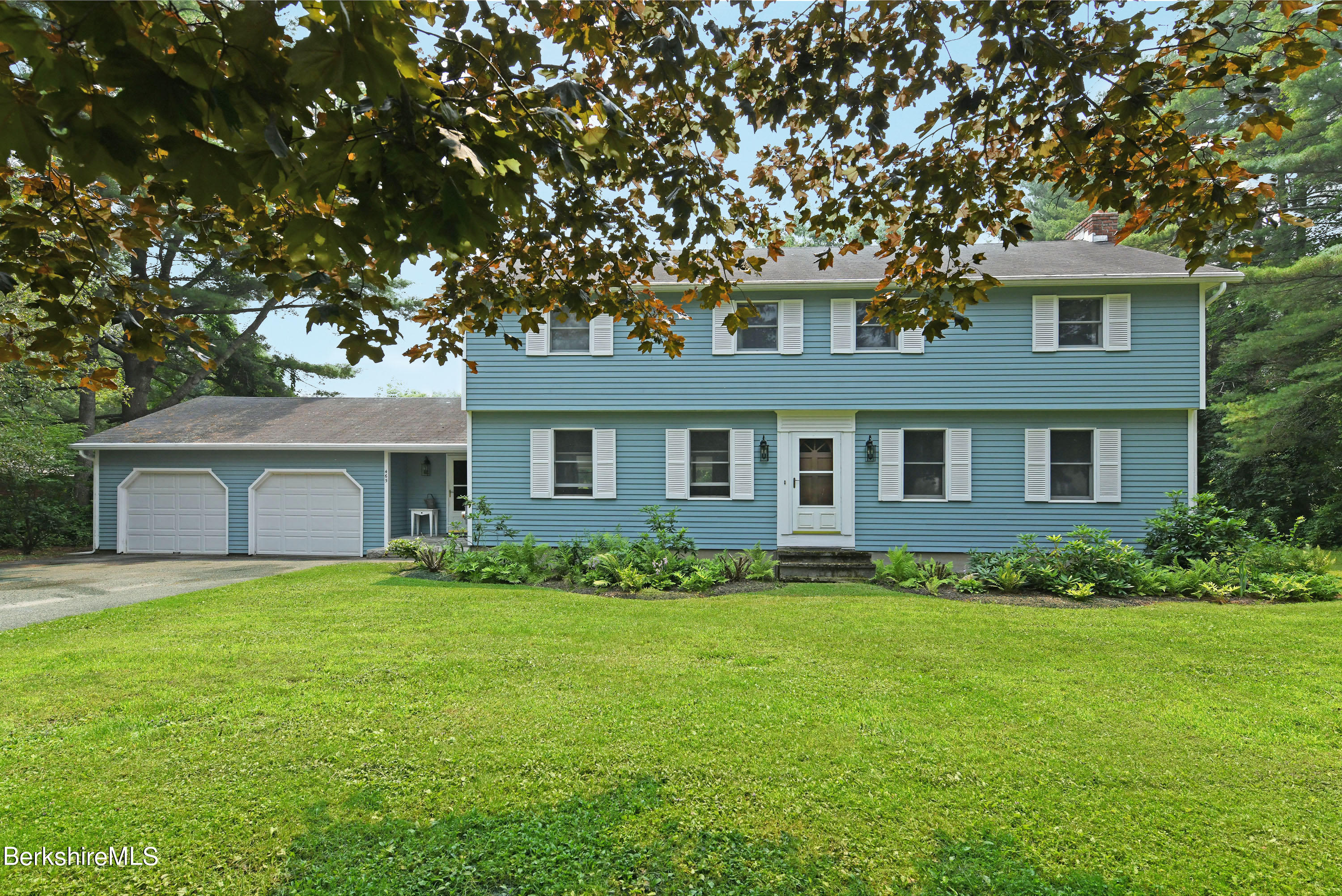 465 Devon Road Lee, MA 01238 - Photo 1 of 36 a front view of a house with a garden