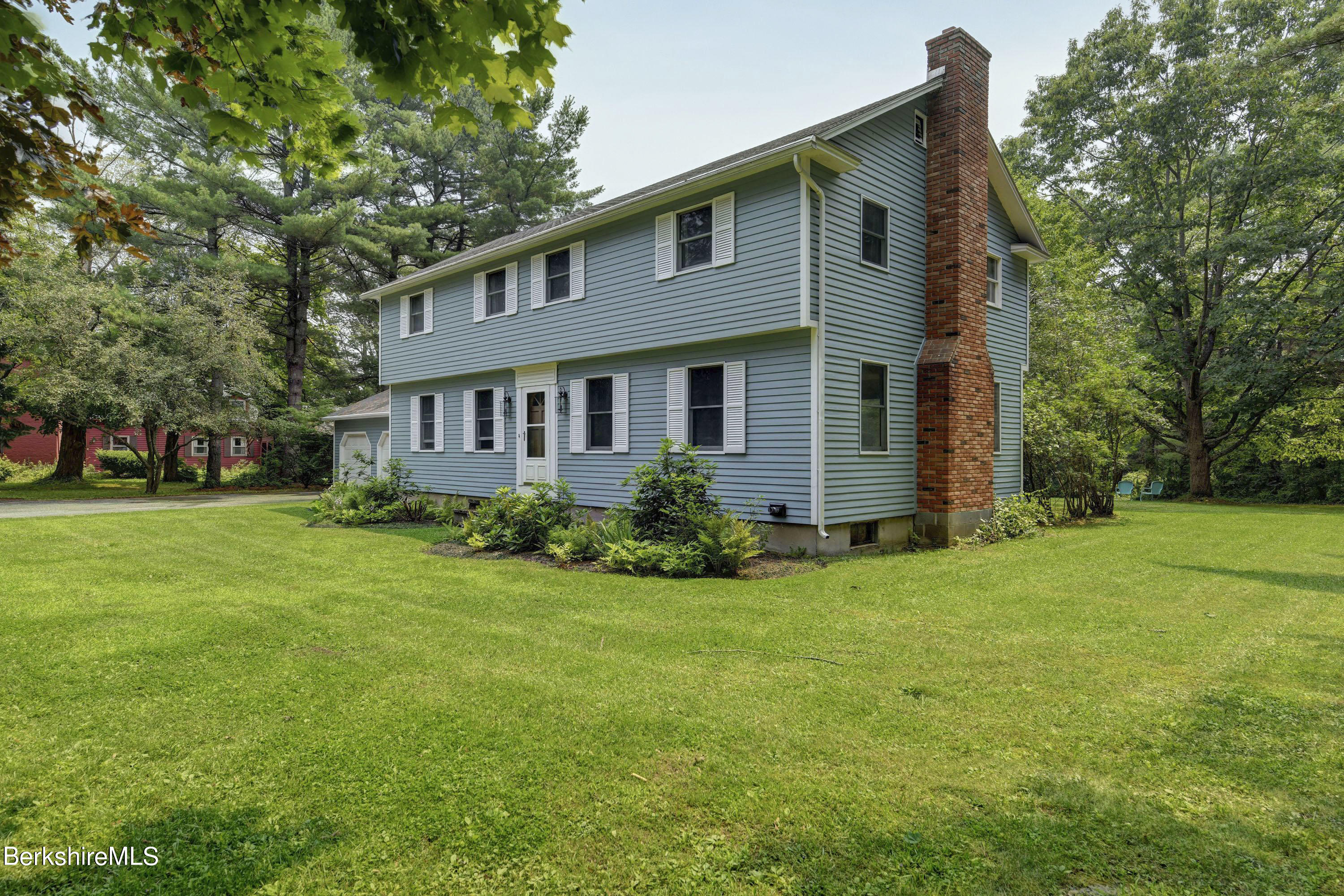 465 Devon Road Lee, MA 01238 - Photo 2 of 36 a front view of house with yard and green space