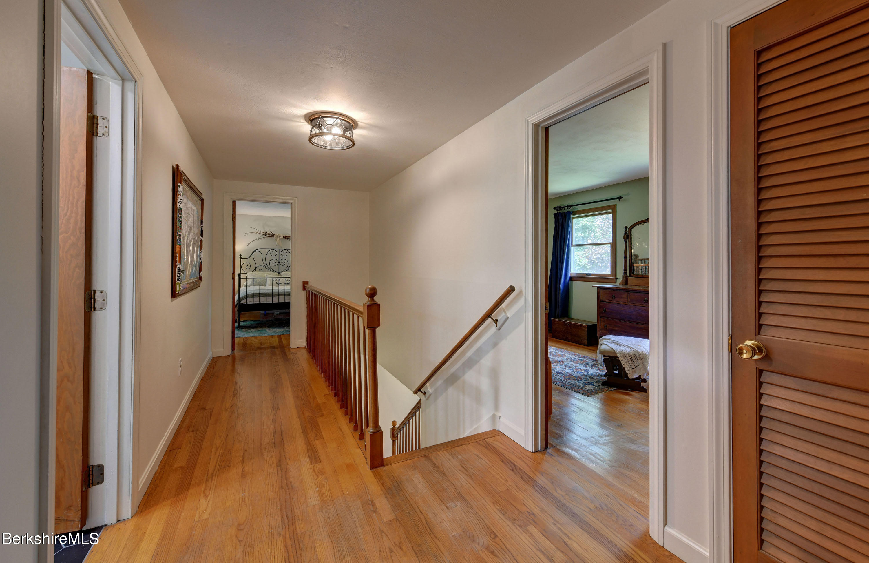 465 Devon Road Lee, MA 01238 - Photo 18 of 36 a view of a hallway view with wooden floor and a living room