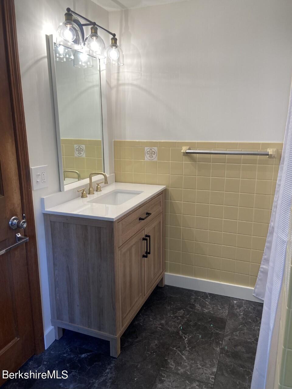 465 Devon Road Lee, MA 01238 - Photo 20 of 36 a bathroom with a sink a vanity and a mirror