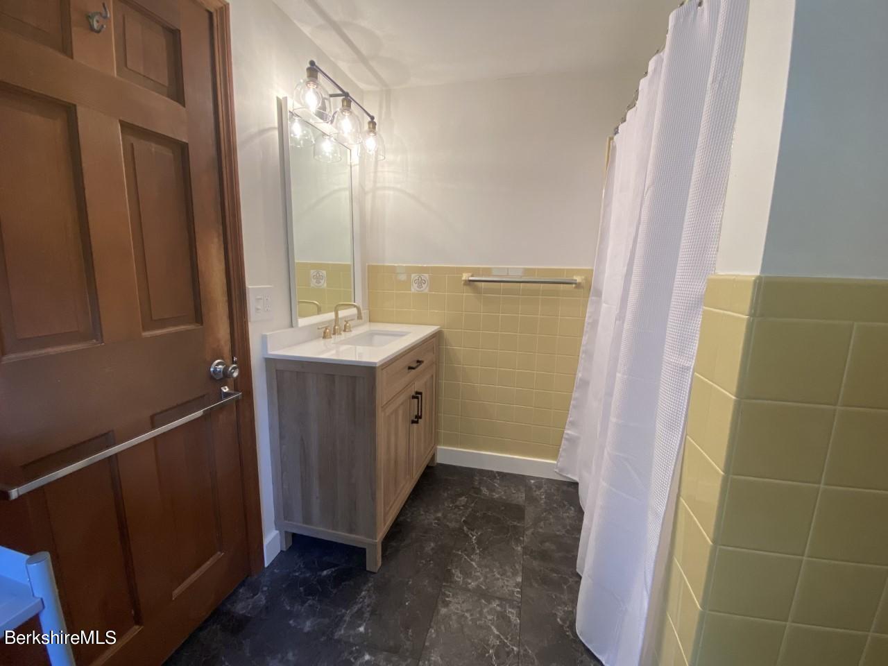 465 Devon Road Lee, MA 01238 - Photo 21 of 36 a bathroom with a sink and a mirror