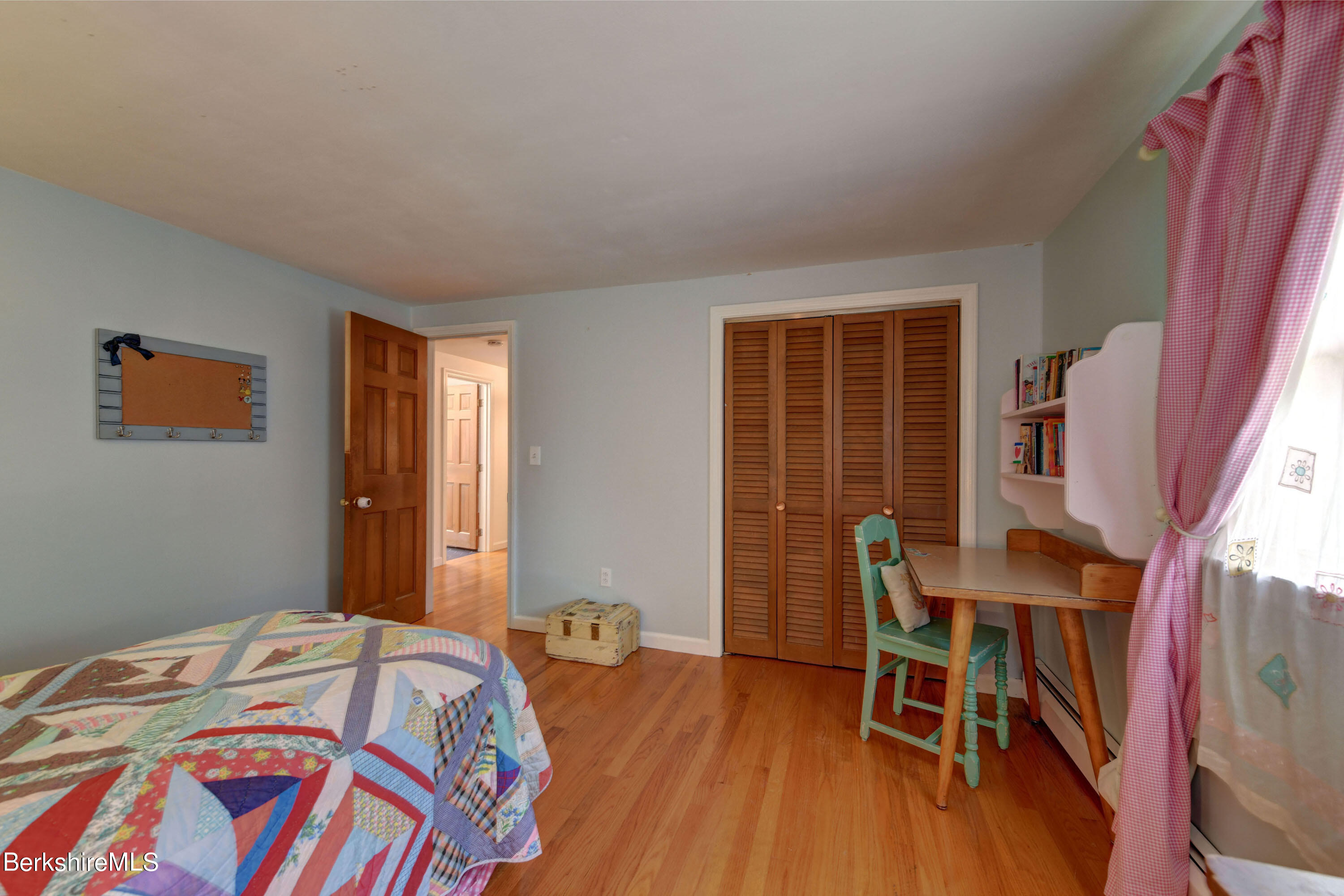 465 Devon Road Lee, MA 01238 - Photo 27 of 36 a bedroom with a bed and a window