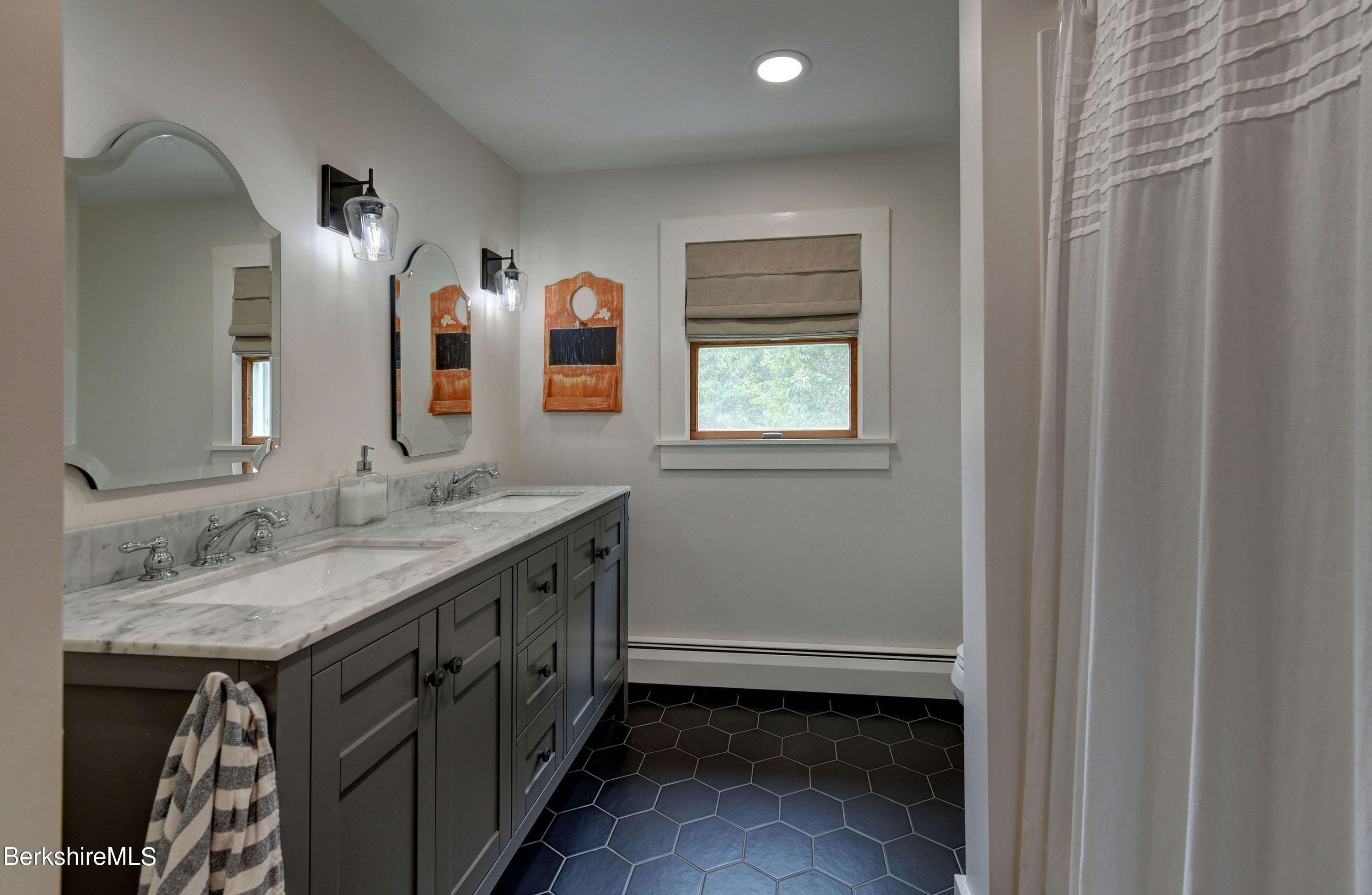 465 Devon Road Lee, MA 01238 - Photo 30 of 36 a bathroom with a sink and a mirror