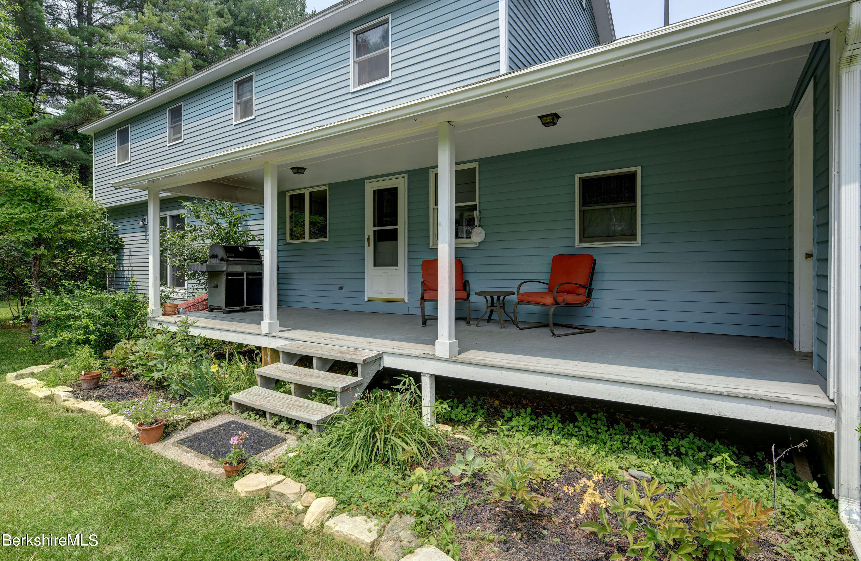 465 Devon Road Lee, MA 01238 - Photo 31 of 36 a front view of a house with a yard