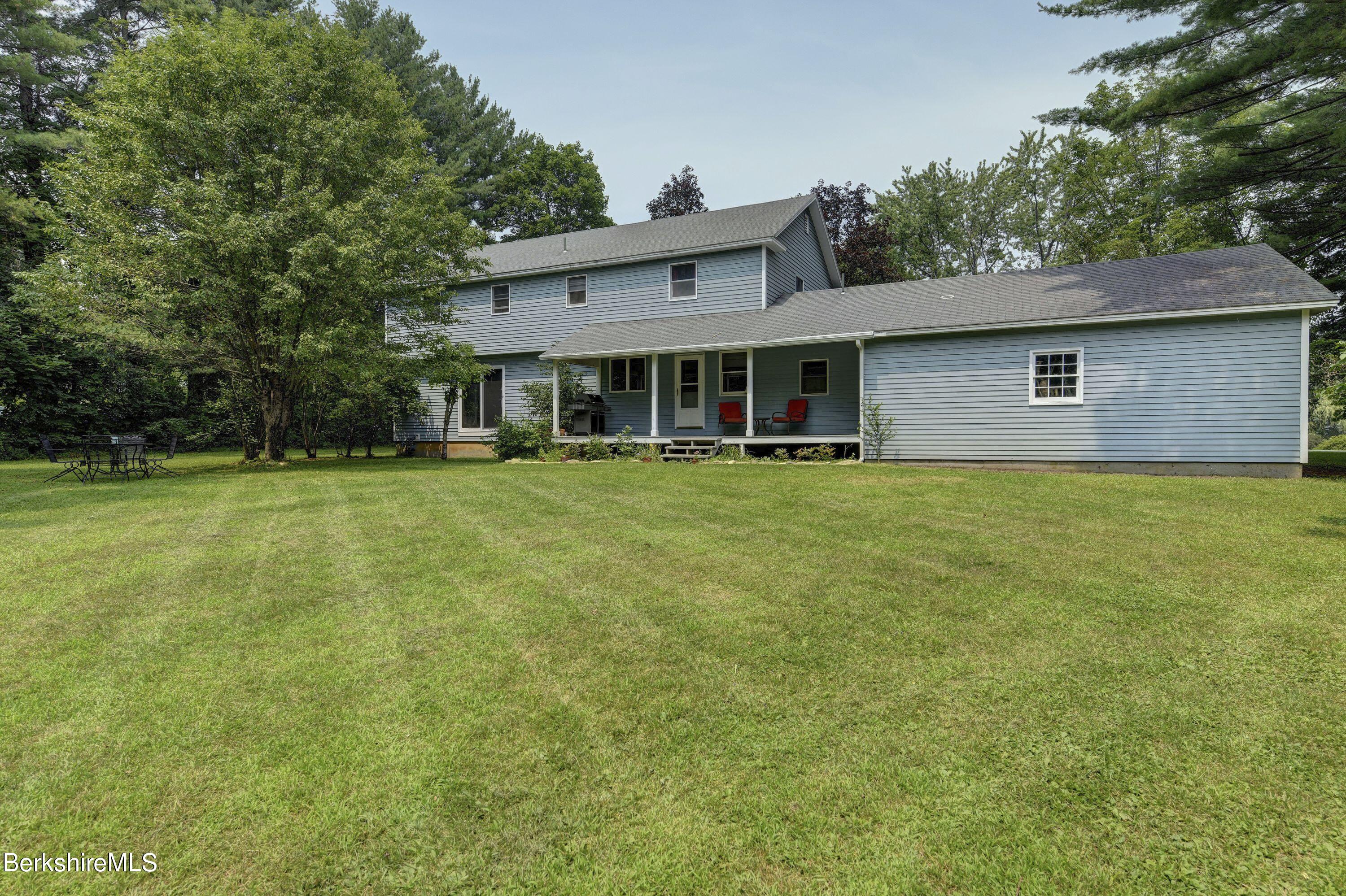 465 Devon Road Lee, MA 01238 - Photo 32 of 36 a front view of a house with a garden