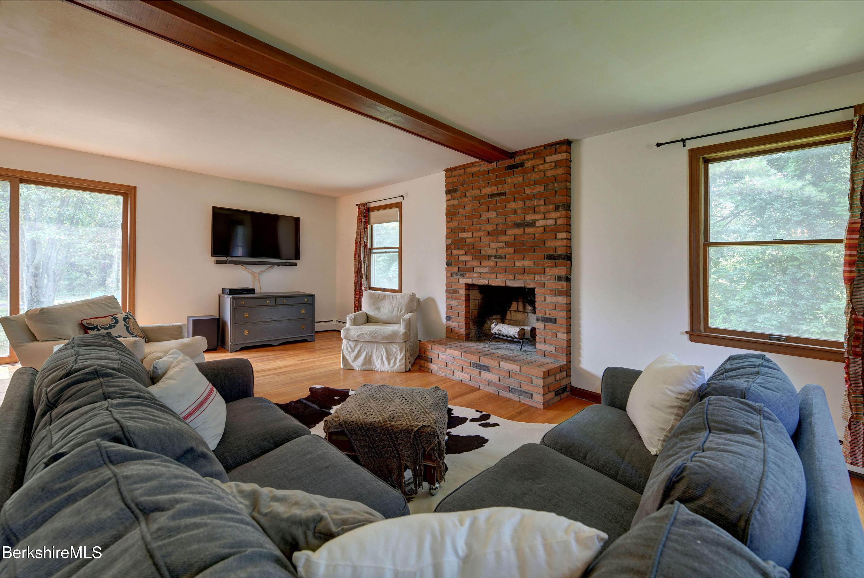 465 Devon Road Lee, MA 01238 - Photo 5 of 36 a living room with furniture fireplace and a flat screen tv