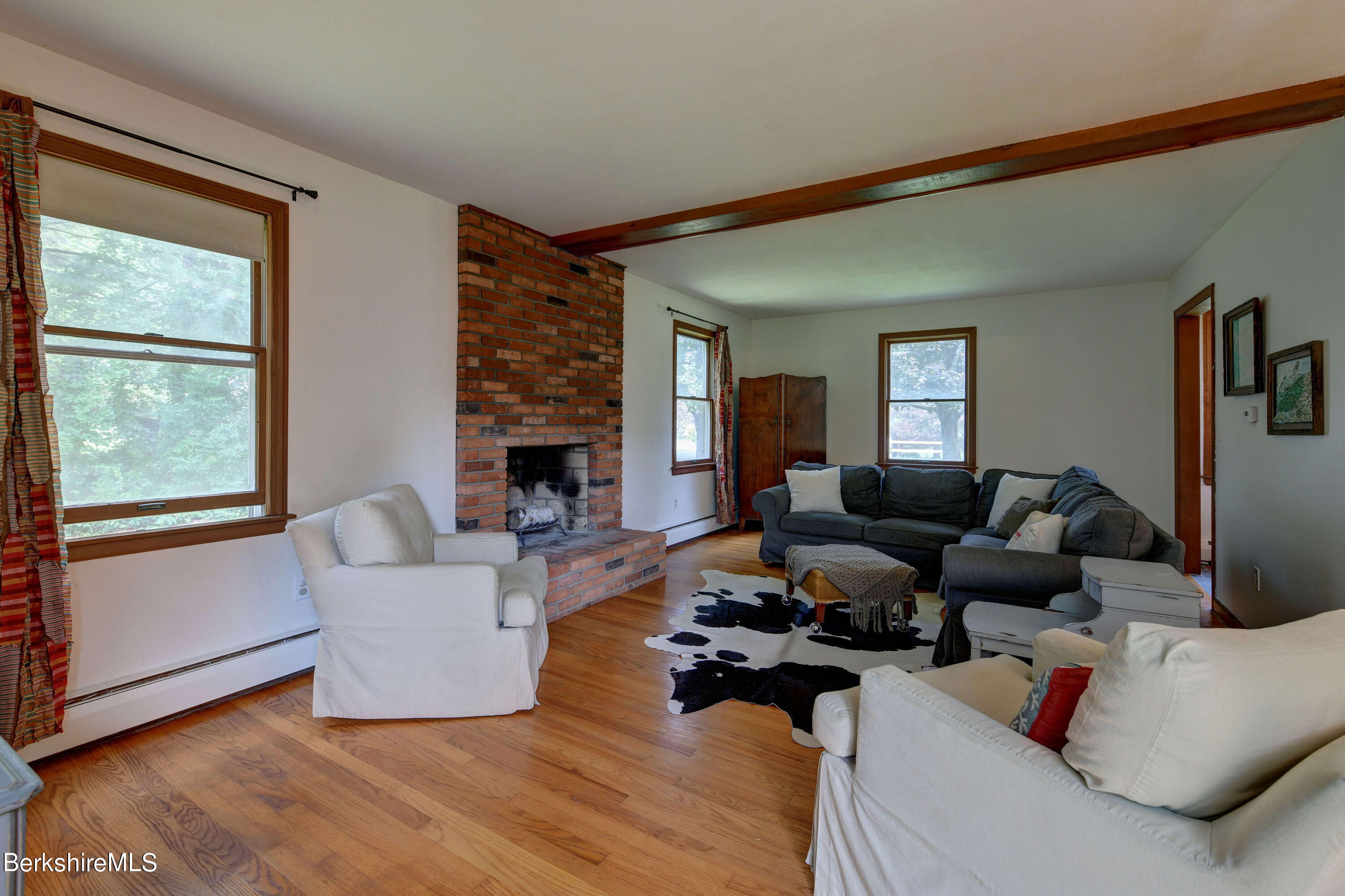 465 Devon Road Lee, MA 01238 - Photo 6 of 36 a living room with furniture or couch and a large window