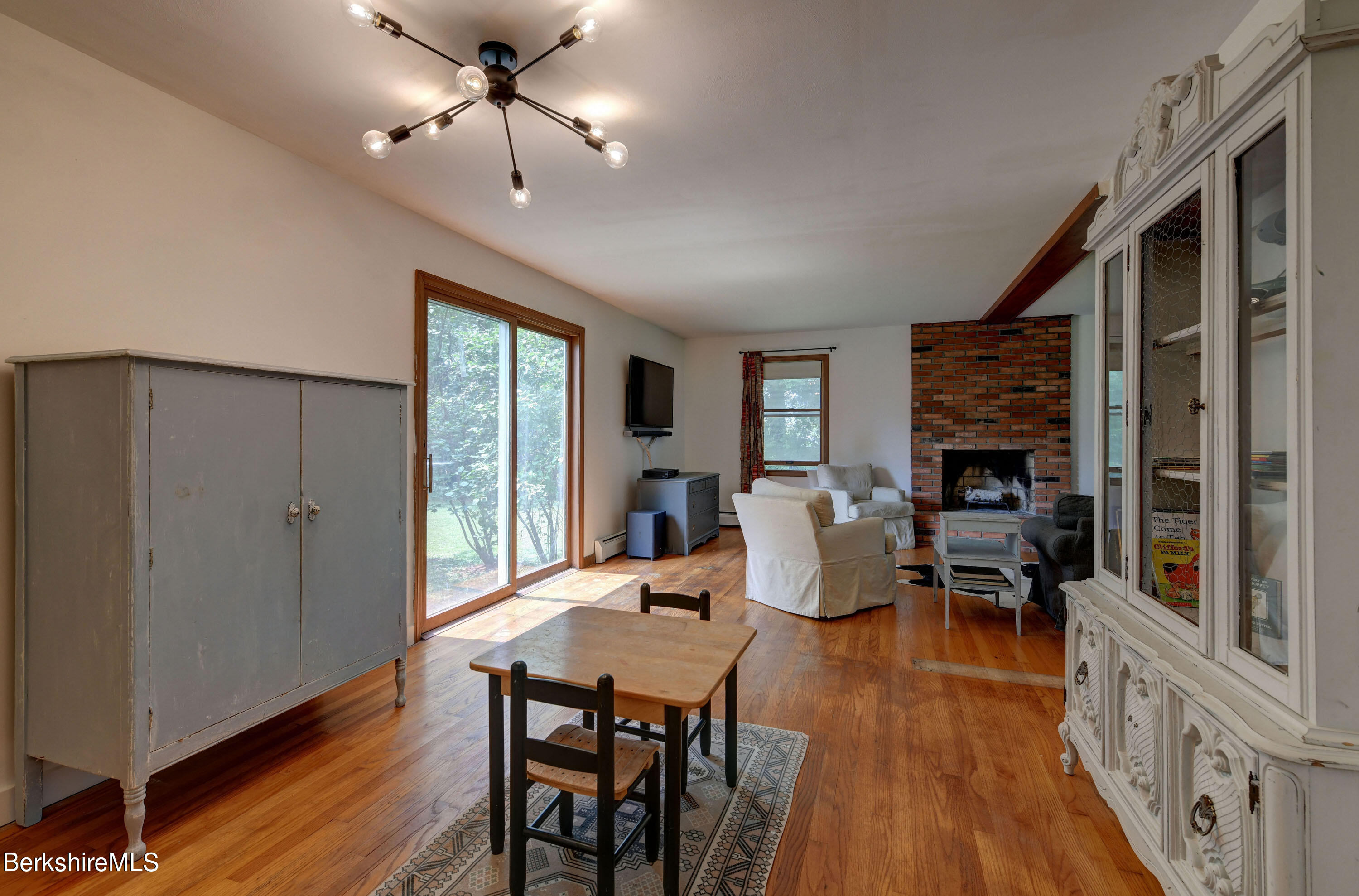 465 Devon Road Lee, MA 01238 - Photo 8 of 36 a view of a dining room with furniture window and wooden floor