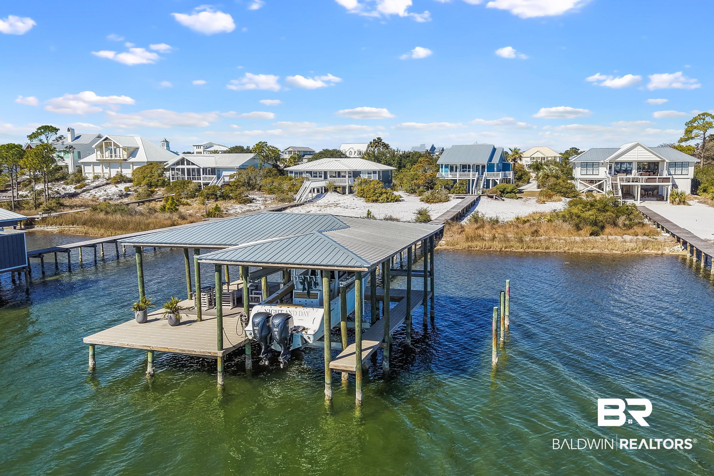 32620 River Road Orange Beach, AL 36561 - Photo 54 of 60 Dock area with boat lift, a residential view, and a water view