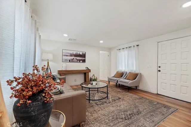 a living room with furniture and a table