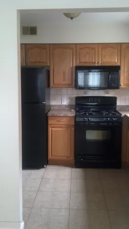 a kitchen with a stove and a microwave