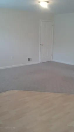 a view of hallway with closet