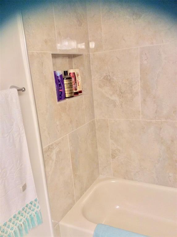 Undisclosed Address Pompano Beach, FL 33069 - Photo 14 of 23 a bathroom with a bathtub