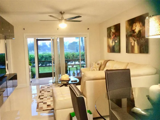 a kitchen with stainless steel appliances a stove a refrigerator and a microwave