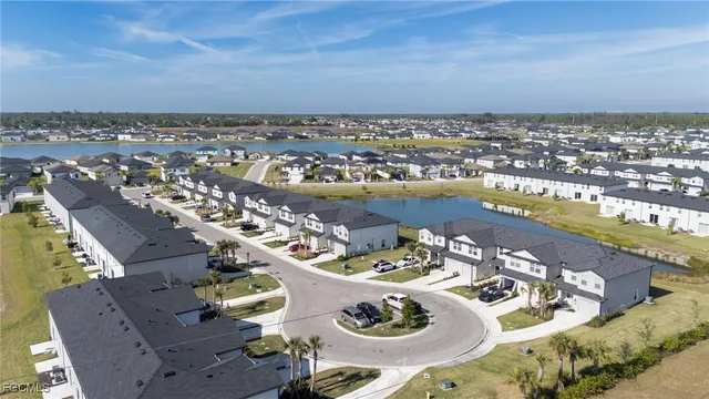 an aerial view of a house with yard table and chairs