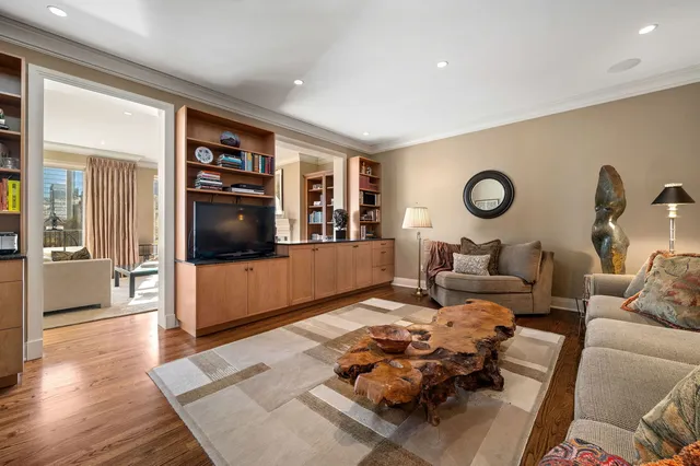 a bathroom with a granite countertop toilet and a sink