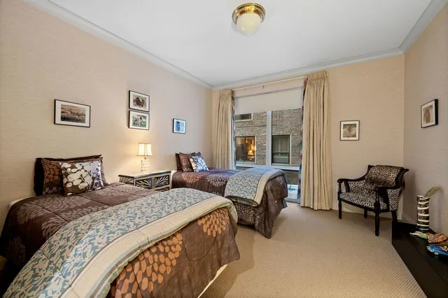 a bathroom with a sink a toilet a mirror and shower