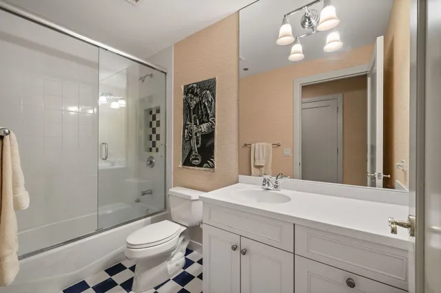a living room with fireplace furniture and a large window
