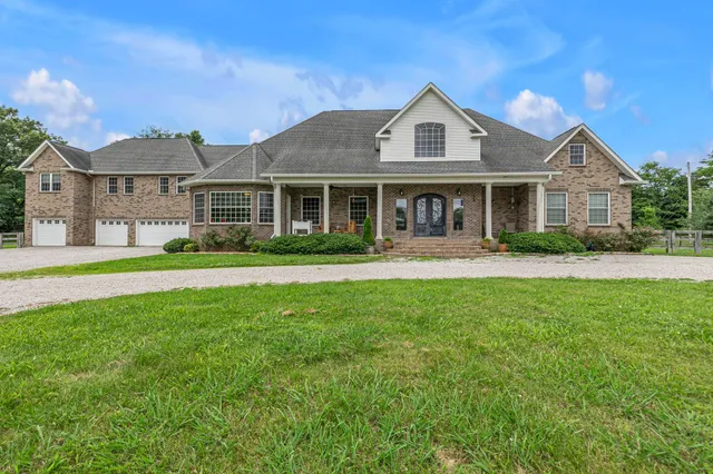 a living room with furniture or kitchen and a wooden floor