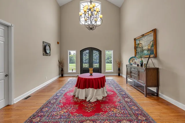 a kitchen with granite countertop white cabinets stainless steel appliances and sink