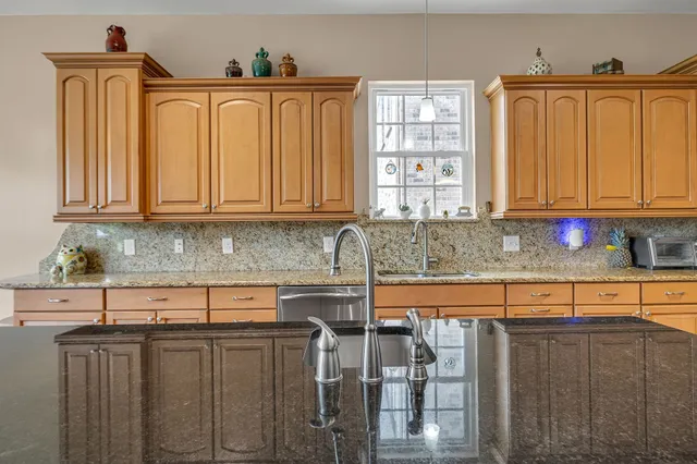 a view of a livingroom with workspace and a window