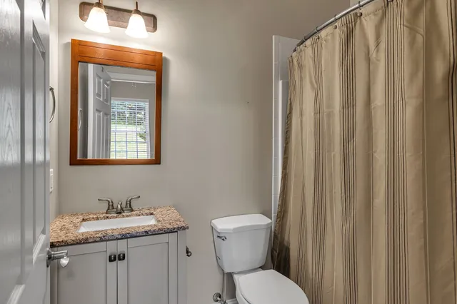 a view of a patio with table and chairs and potted plants