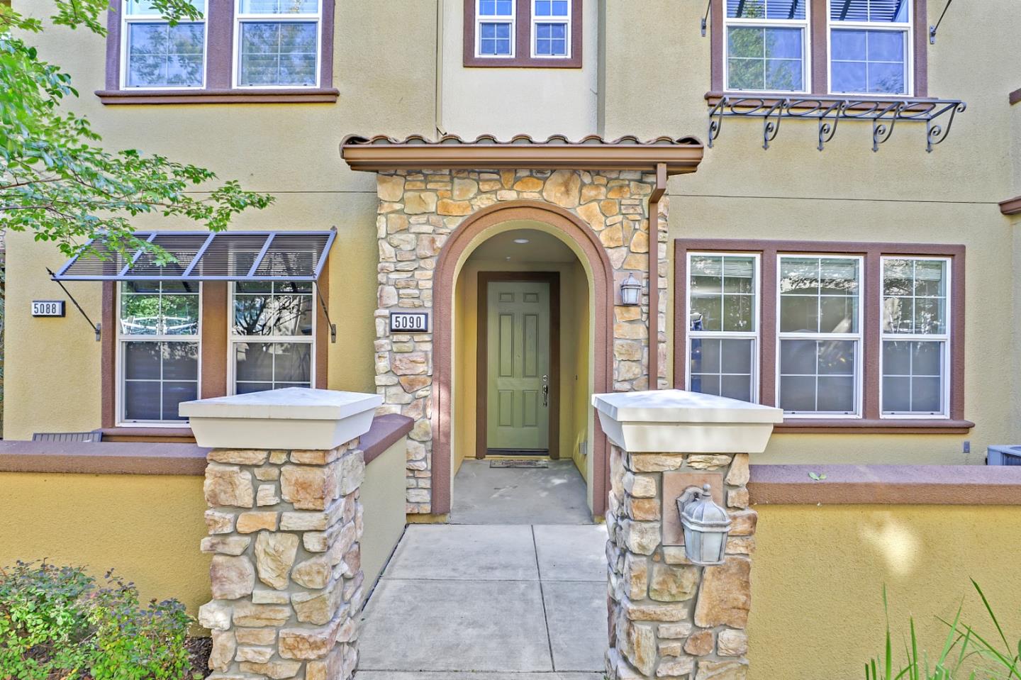 5090 Fioli Loop San Ramon, CA 94582 - Photo 1 of 36 a front view of a house with swimming pool and glass windows